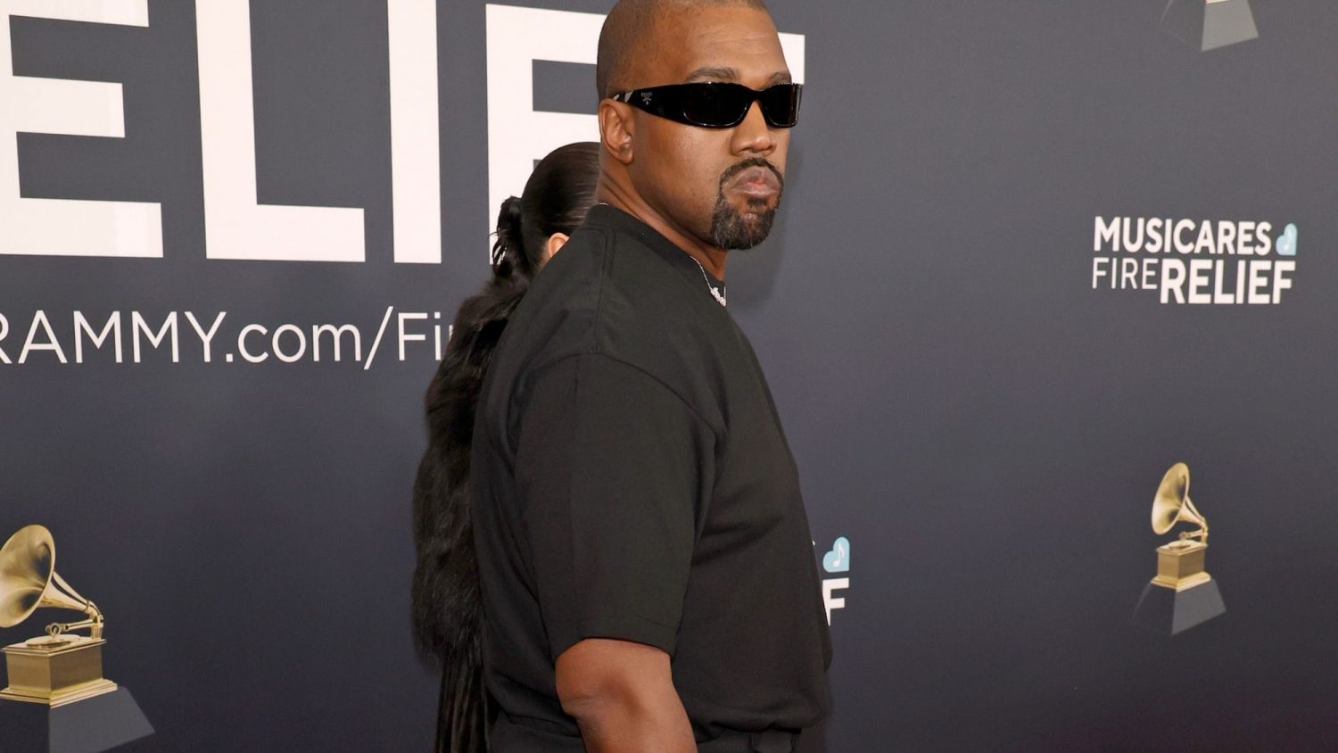 Kanye West settles lawsuit with former assistant over allegations